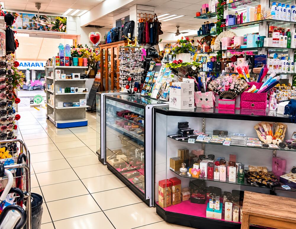 Perfume and cosmetics shelves at Farmacia Olas Altas